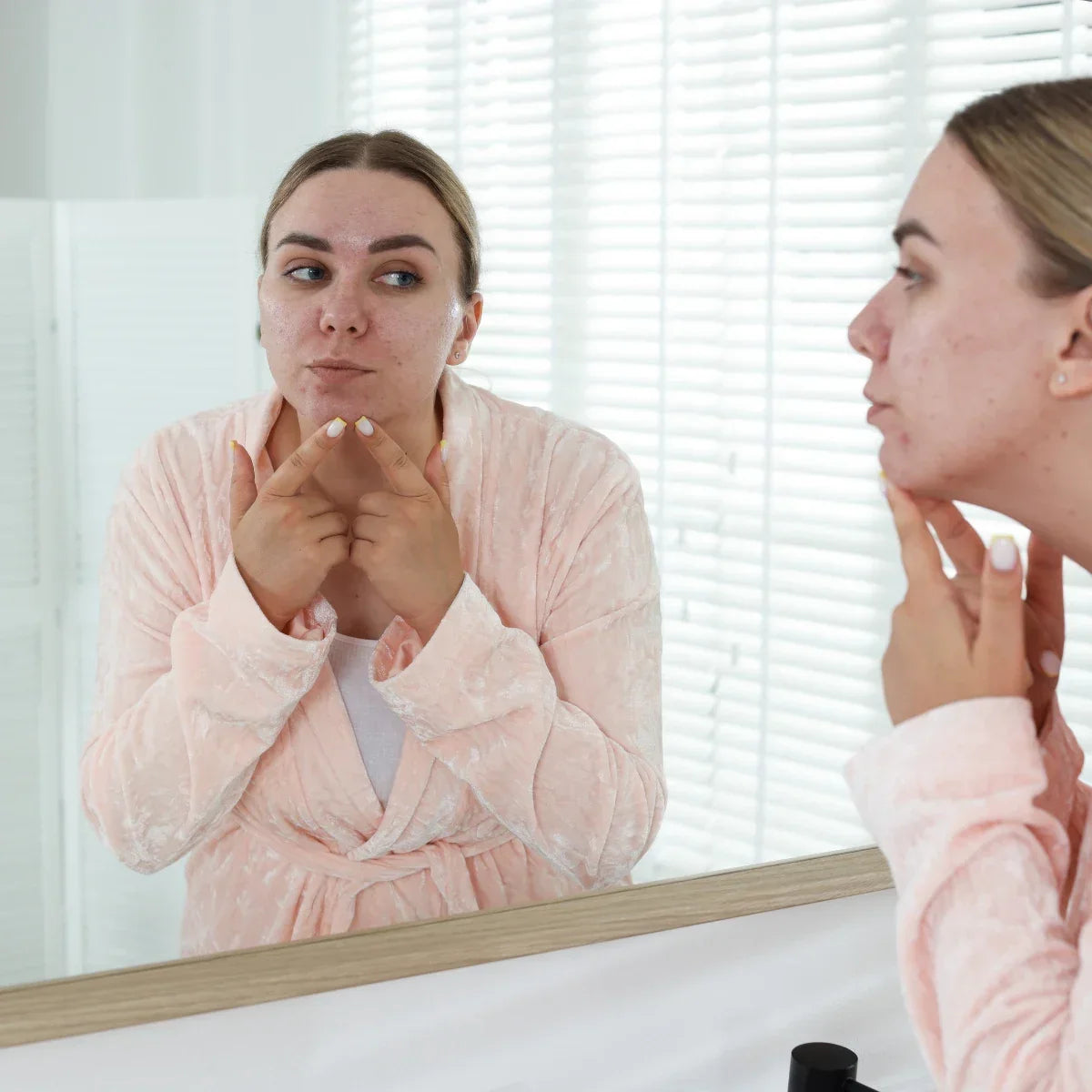 Woman dealing with hard water breakout in bathroom