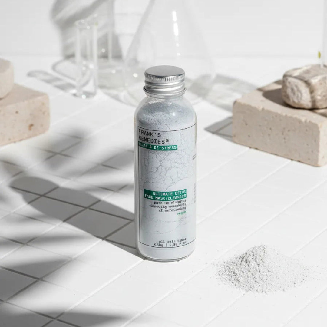 Bottle of Detox face mask a white surface with a white background