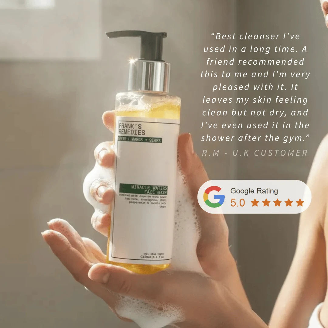 Hand holding a bottle of Frank's Remedies miracle waters face wash cleanser with a five-star Google rating displayed.